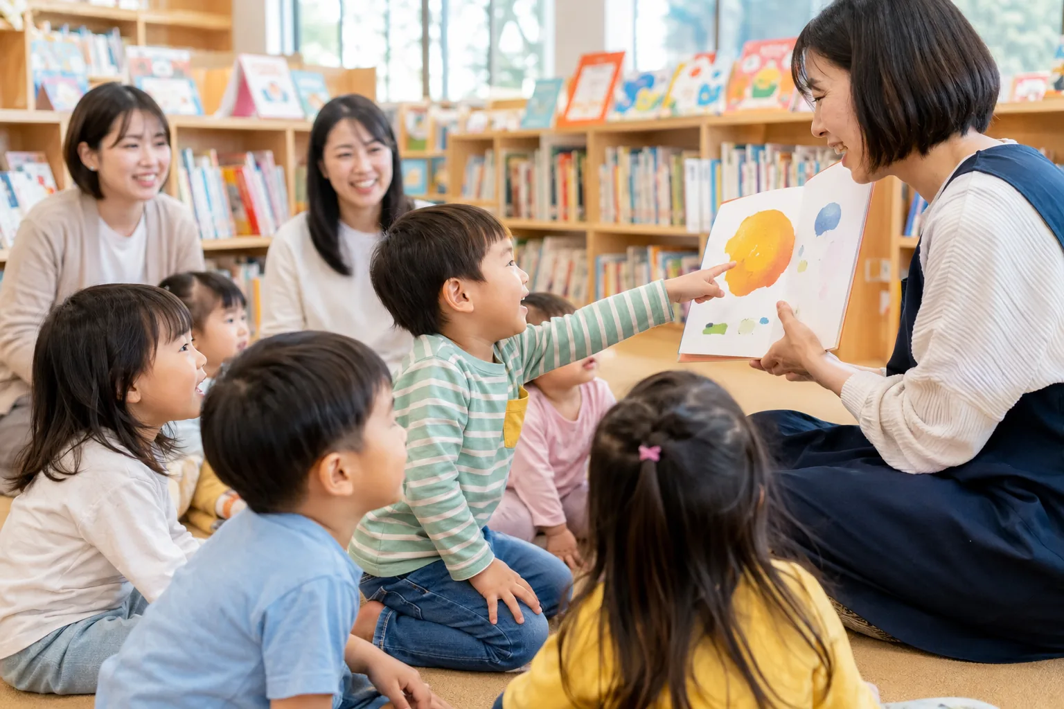 図書館のおはなし会で絵本に夢中になる子どもたち